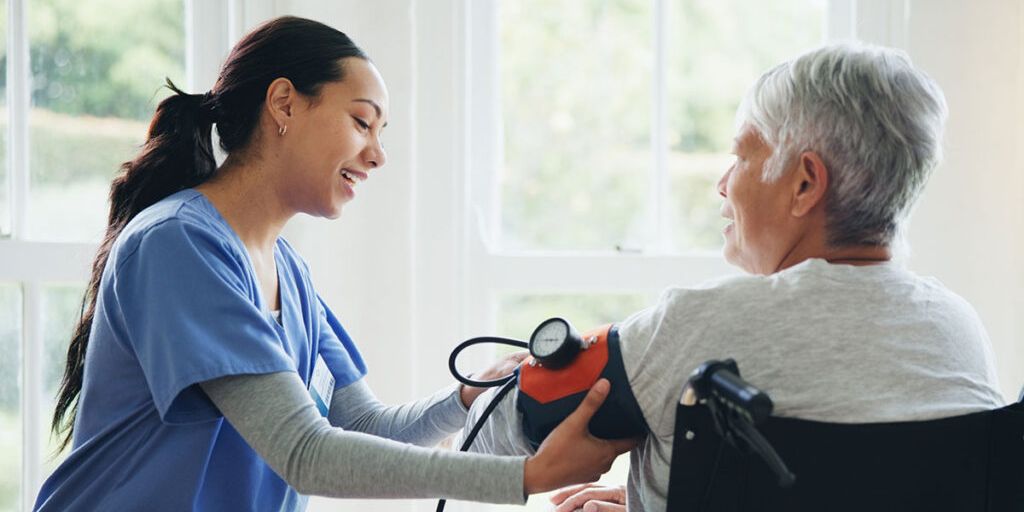 caregiver-and-senior-in-wheelchair-for-blood-pressure-1